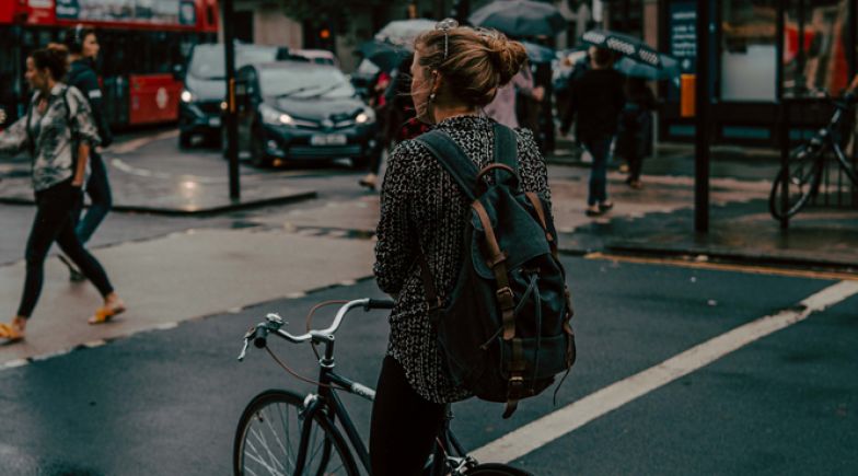 Woman riding bike on London street