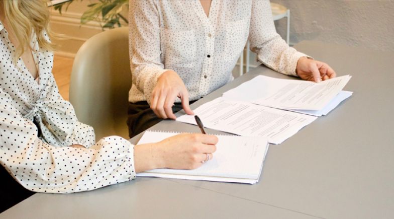 Women looking at documents